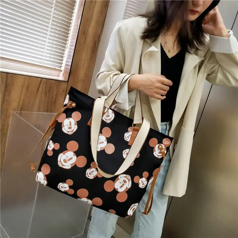 Women's shoulder bag featuring Mickey Mouse stylish canvas bag storage bag high-capacity Black white schoolgirl shoulder bag