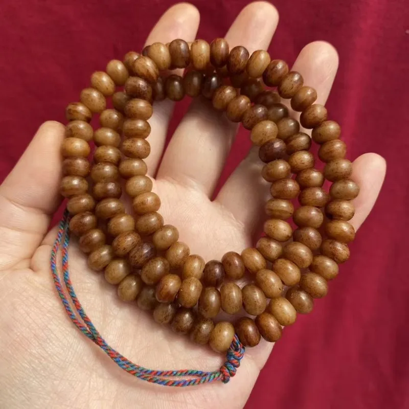 -style prayer made from camel and yak bone featuring traditional Tibetan medicinal tablets 108 beads