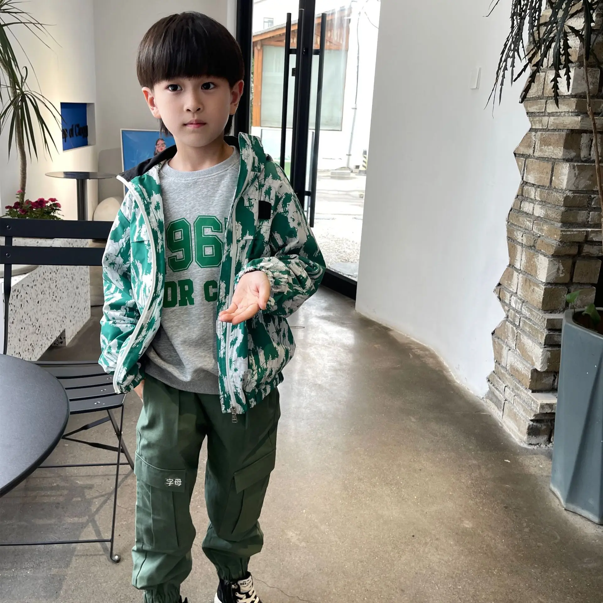 

Dio Style Green Printed Windbreaker Hooded Jacket For Girls And Boys LAB CICI