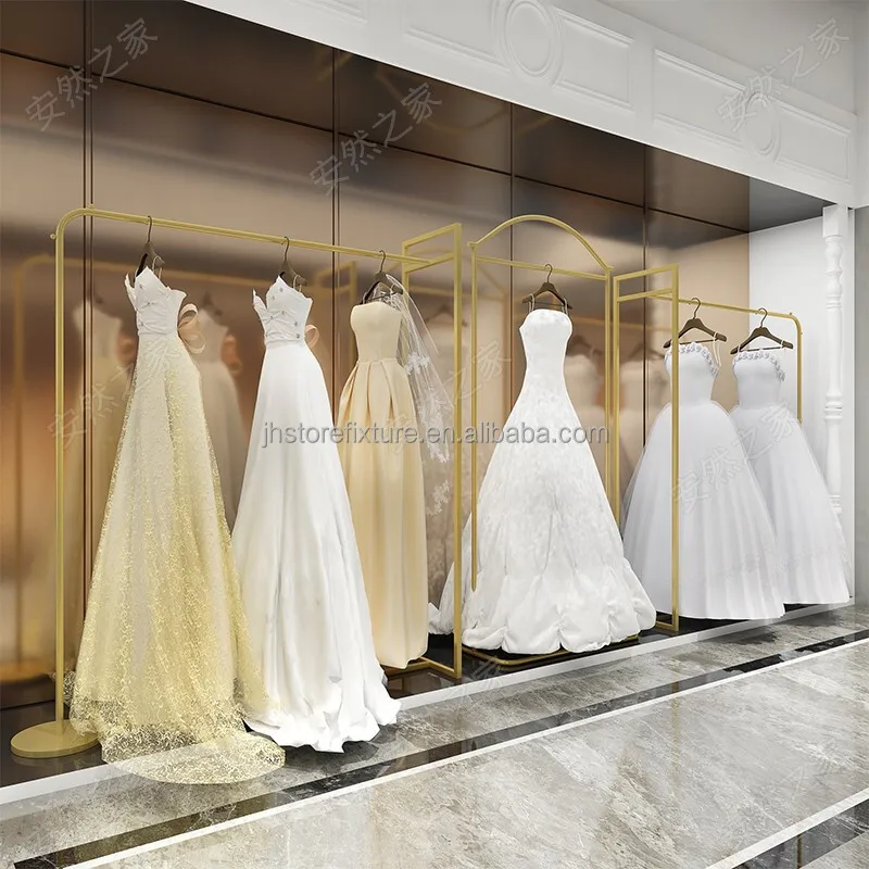 

Custom.European Luxury High Quality Gold Dresses Rack Creative Art Rack Free Standing Hanging Clothing Display