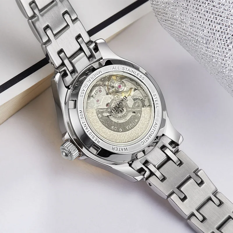 ساعة يد ميكانيكية أوتوماتيكية للزوجين من BAOFEILUN مصنوعة من الفولاذ المقاوم للصدأ وكريستال الياقوت وعرض التاريخ 50 متر مقاومة للماء هدية فاخرة
