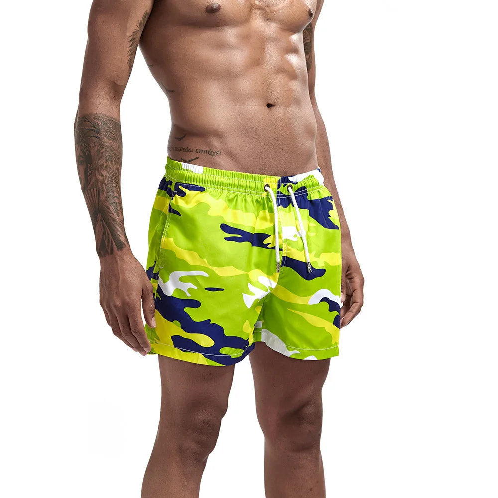 Calças de surf de praia masculinas casuais shorts de três pontos tendência confortável impresso bolso lateral esportes shorts de fitness estilo masculino