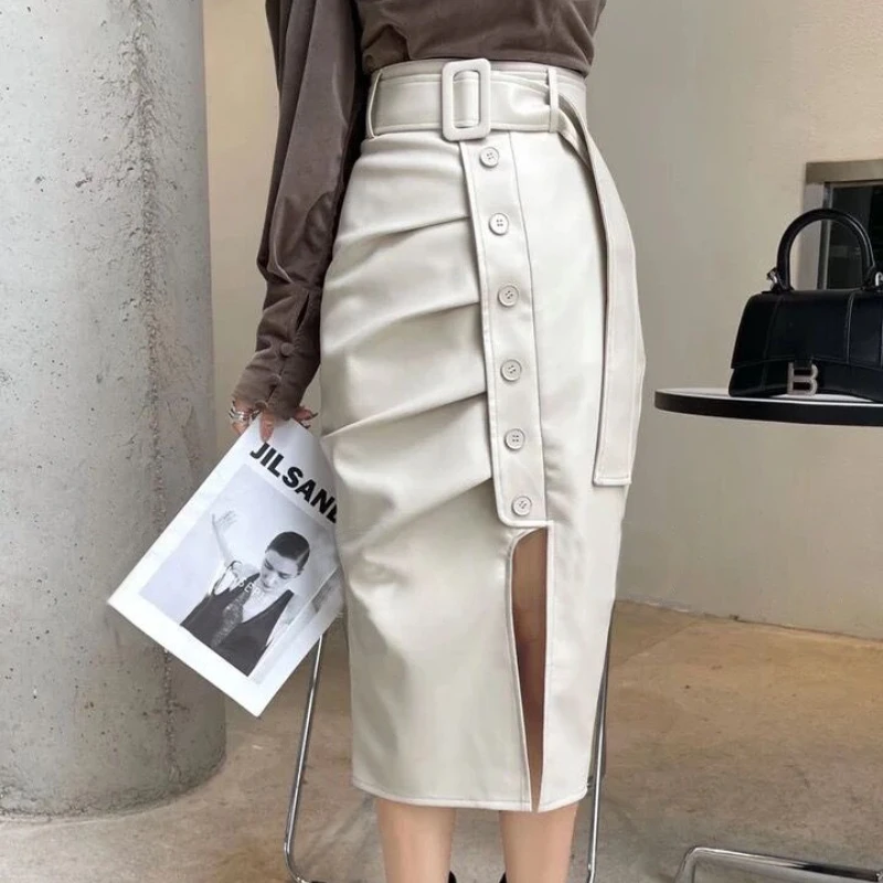 กระโปรงหนังทรงเอวสูงผ่าข้าง ดีไซน์พลีทแบบพันรอบตัว สไตล์แฟชั่นใหม่สำหรับฤดูใบไม้ร่วงและฤดูหนาว ทรงเอ-ไลน์ ความยาวปานกลาง  สำหรับผู้หญิง  ดีไซน์ไม่สมมาตร เซ็กซี่  ทรงเข้ารูป