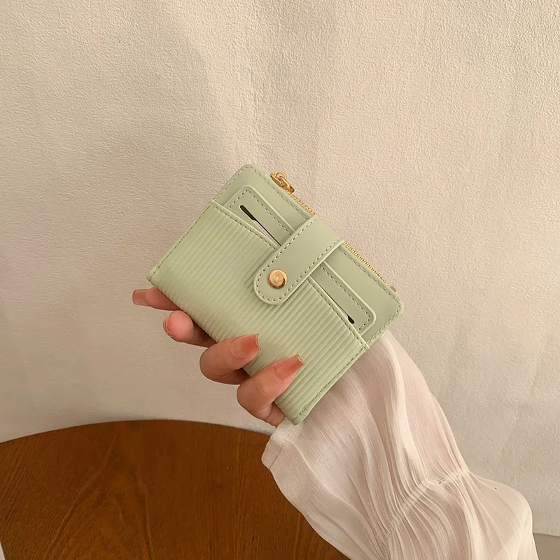 محفظة نسائية قصيرة جديدة لربيع وصيف النسخة الكورية مشبك مطبوع بسيط كل شيء قابل للطي محفظة نسائية قصيرة من جلد البولي يوريثان