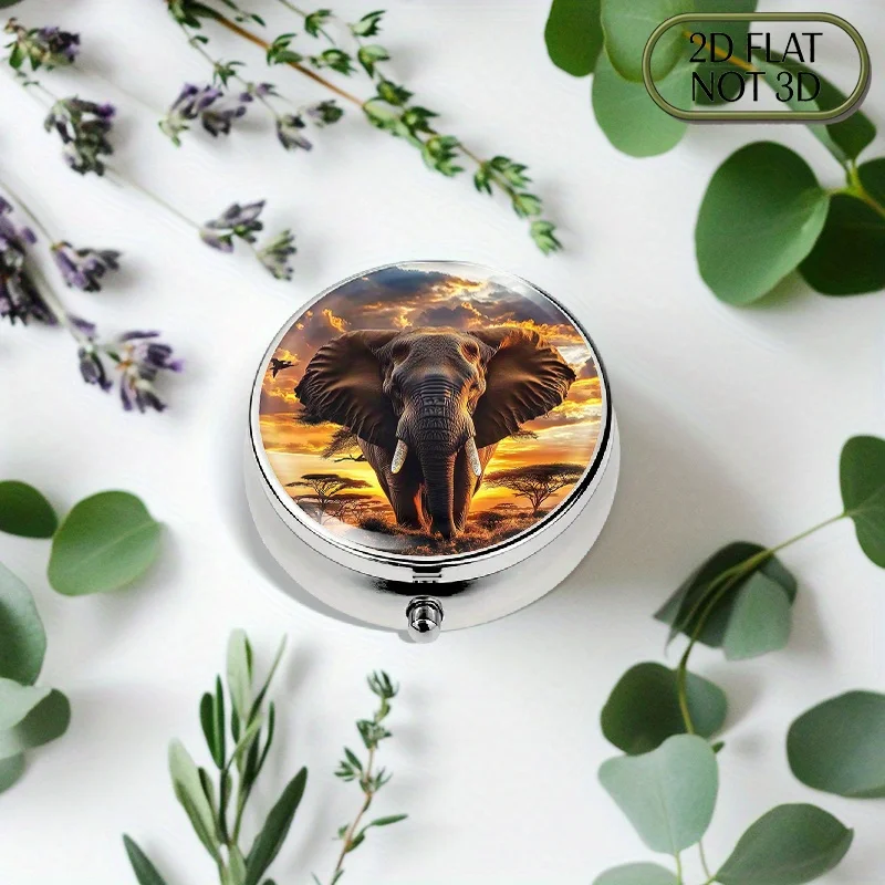 Single-piece flat, portable, round metal pill box, adorned with a majestic elephant pattern against the backdrop of a sunset on the African savanna. It can stylishly store daily medication and is also suitable for storing vitamins and small accessories. It is an excellent gift choice, made of durable material and featuring a flat design