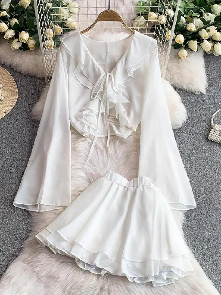 

Весенние женские однотонные короткие топы с рюшами и v-образным вырезом, расклешенные длинные рукава, солнцезащитный крем на шнуровке + короткая юбка с высокой талией, комплекты из двух предметов