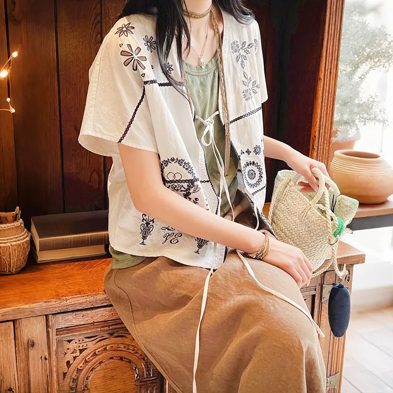 

Withered 2026 Summer Cigarette Ash White Cross Embroidered Angel Hollow Flower Silhouette Tied V-neck Top