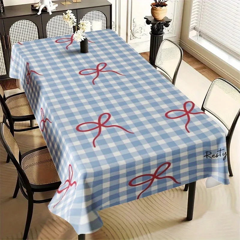 One rectangular tablecloth with blue and white checkered pattern and a bow at the corner, made of polyester material.