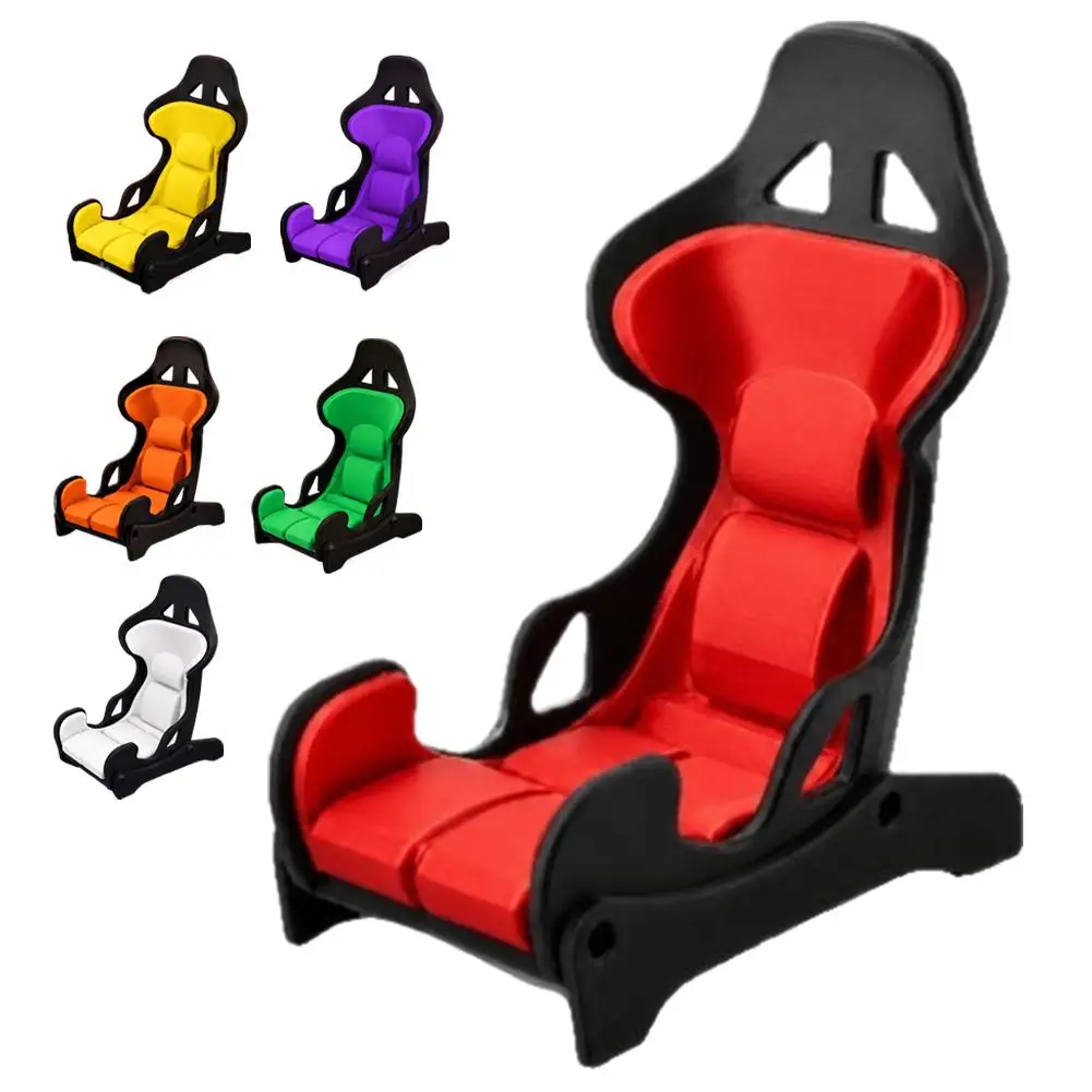 Racing Seat Phone Stand In Red And Black For Office Desk Use With A Bucket Seat Design For Watching Videos And Mobile Gameplay