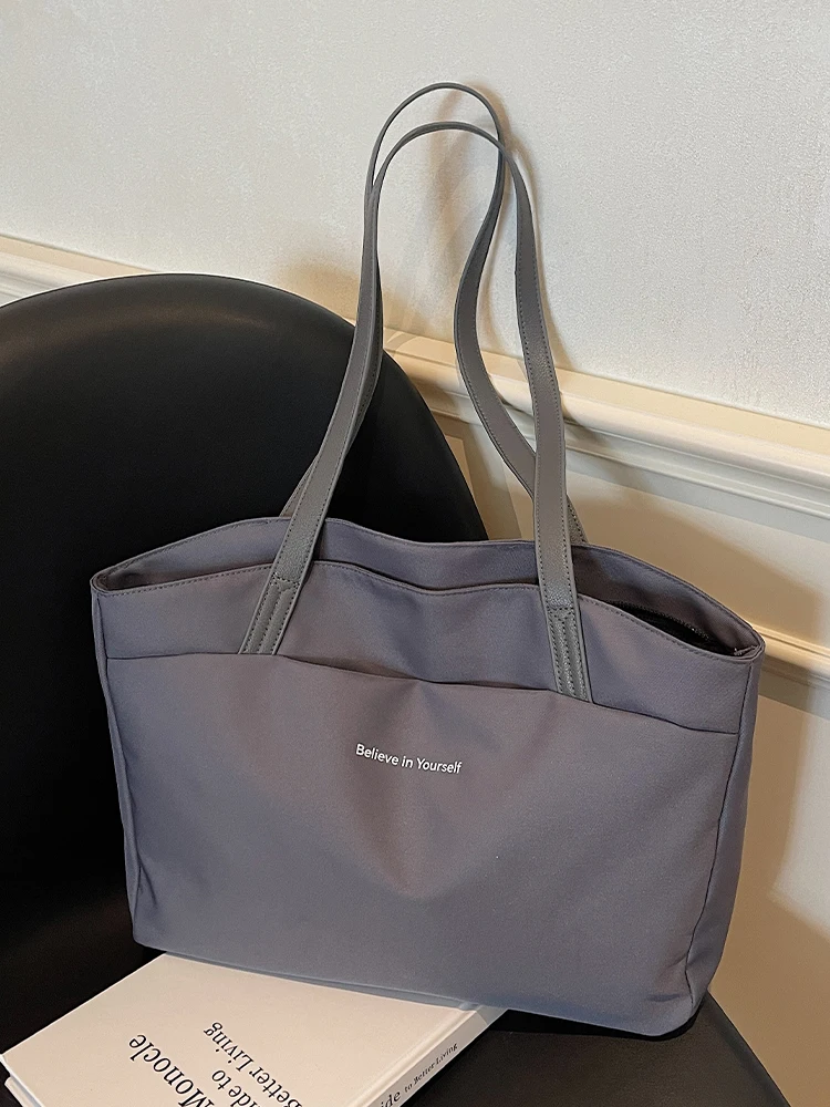 Bolsa tote feminina de grande capacidade de pano de boi 2025 novo sle outono inverno versátil bolsa crossbody bolsa de viagem de alta qualidade