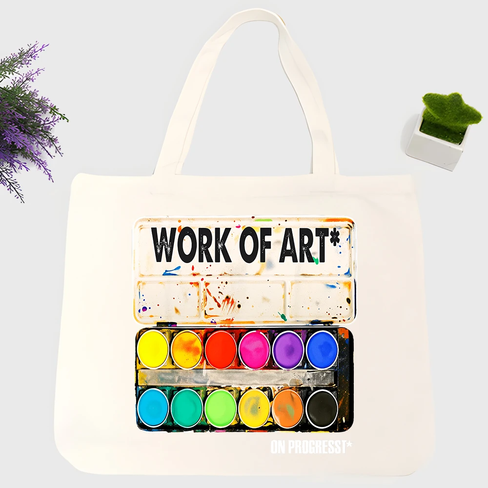 Men's watercolor palette graphic canvas tote bag with typography print, ideal for artistic daily use and casual outings