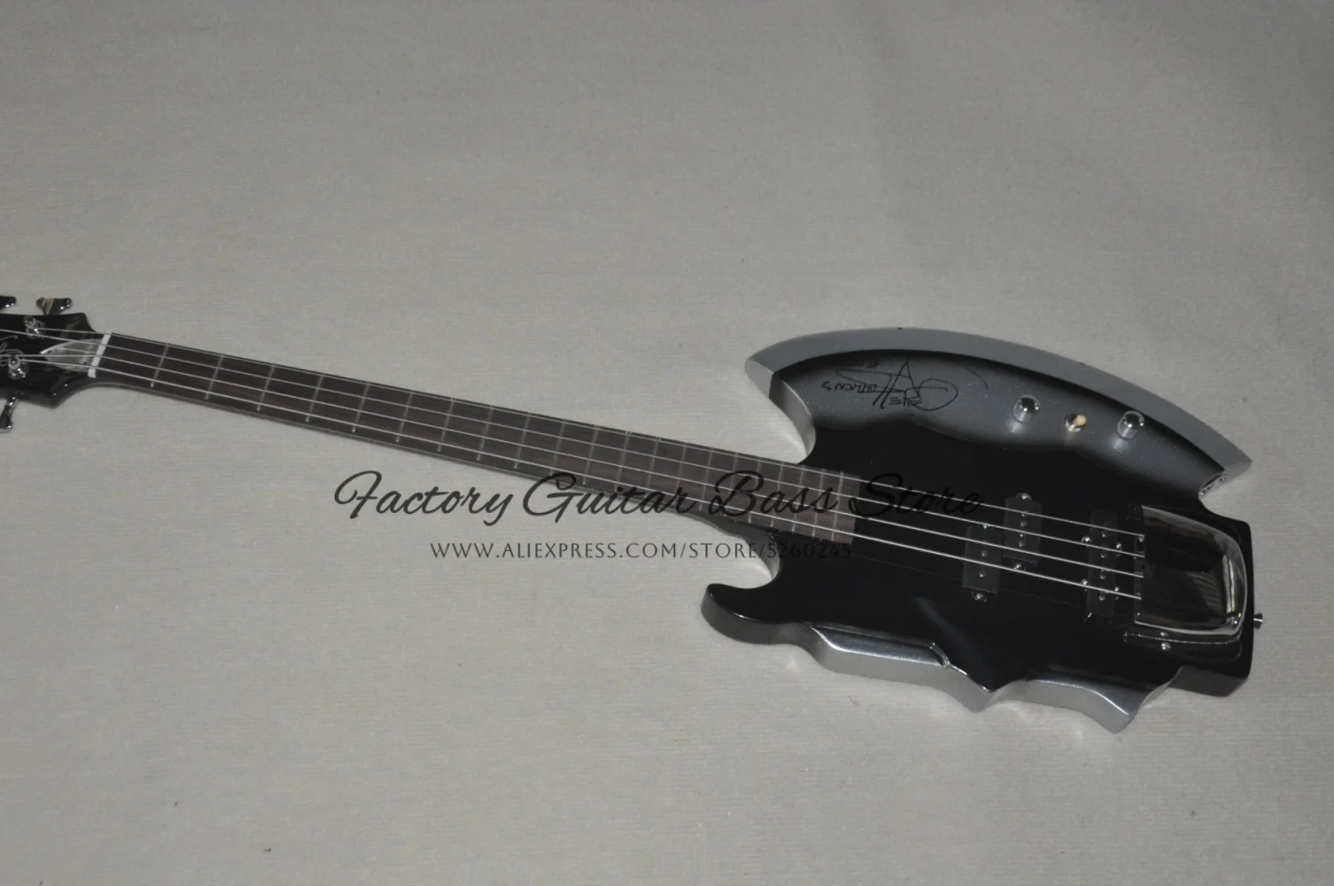 4 string black guitar, fixed bass bridge, symbolizing the bass body, maple neck, axe-shaped bass , customizable