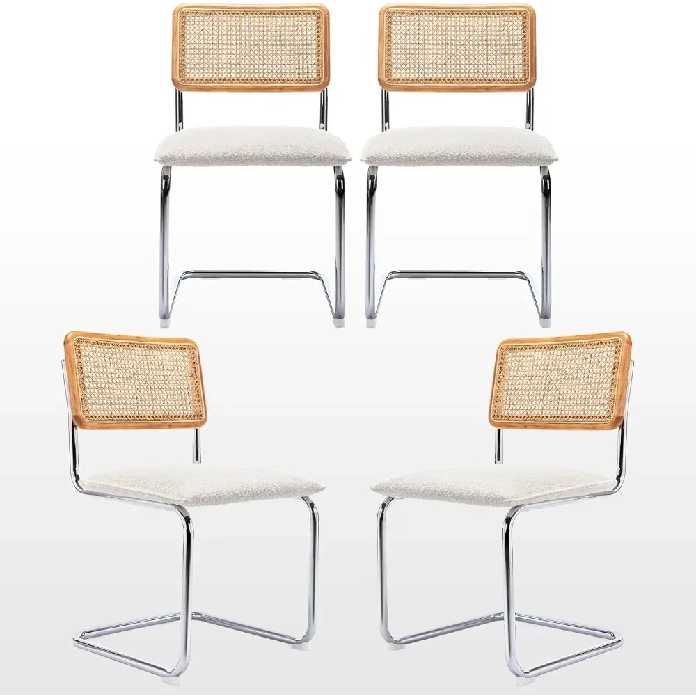 A set of 4 soft cushioned rattan dining chairs, featuring armless chairs, natural rattan backrests, and stainless steel bases