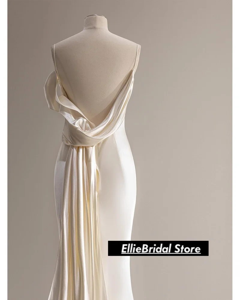 エレガントな白いサテンのストラップレスのイブニングドレス、アフリカの女の子のためのロングバックレスマーメイドプロムドレス、ベスティド・デ・ガラ2025、カスタマイズ可能