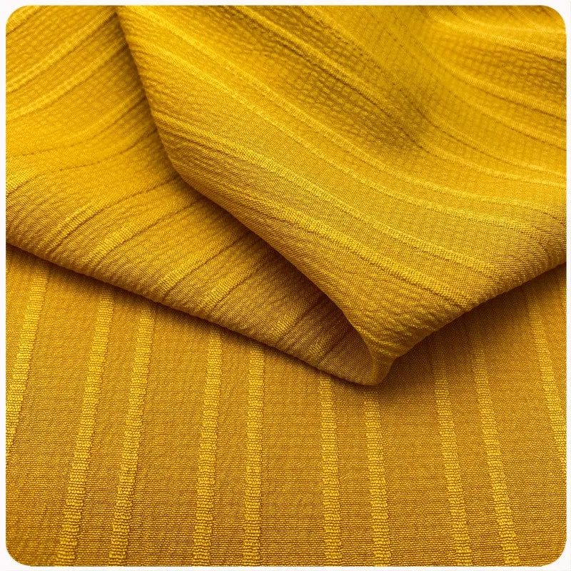 The wavy and pleated fabric is available in multiple colors for soft comfortable spring summer fashion shirts dresses