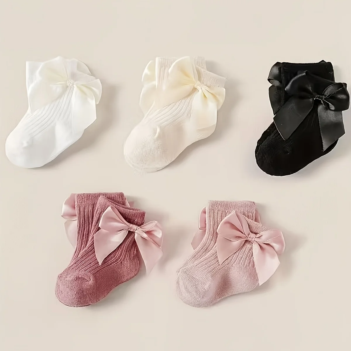 5 pairs of baby socks decorated with candy-colored bows in four seasons.