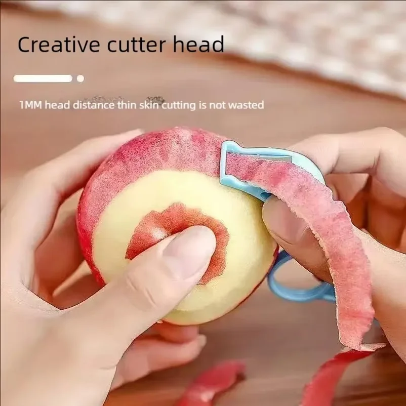 Fruit peeler for peeling oranges and apples. Hand-powered fruit peeling device
