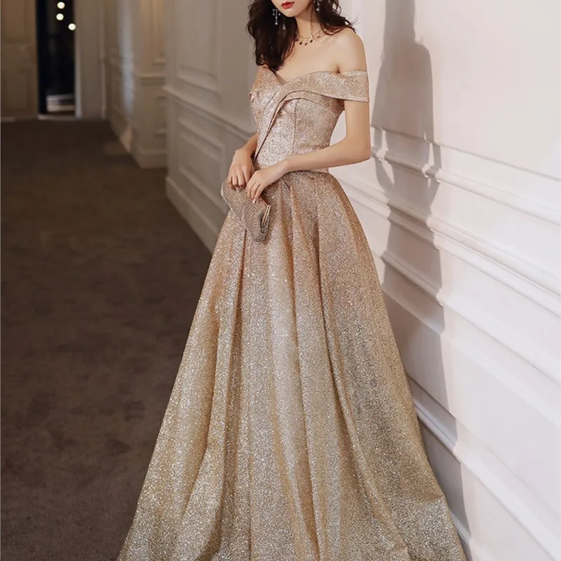 

Champagne gold banquet temperament long line shoulder vocal music test light luxury host dress