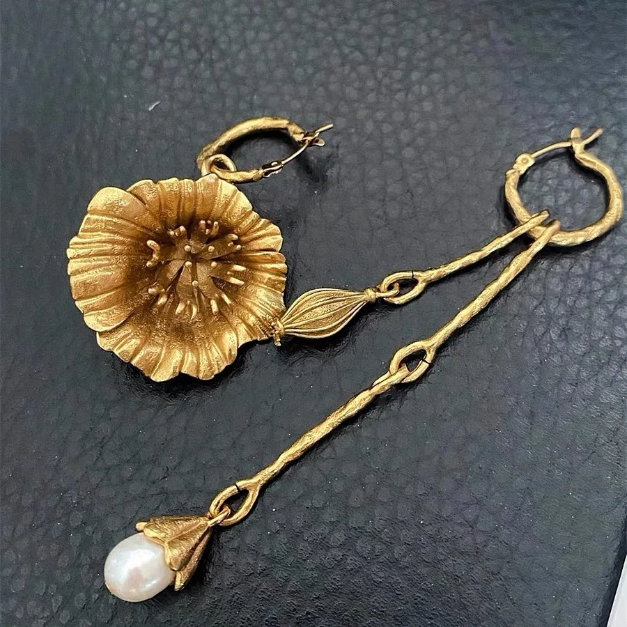 

Длинные серьги с жемчужной кисточкой, легкая роскошь и ретро.