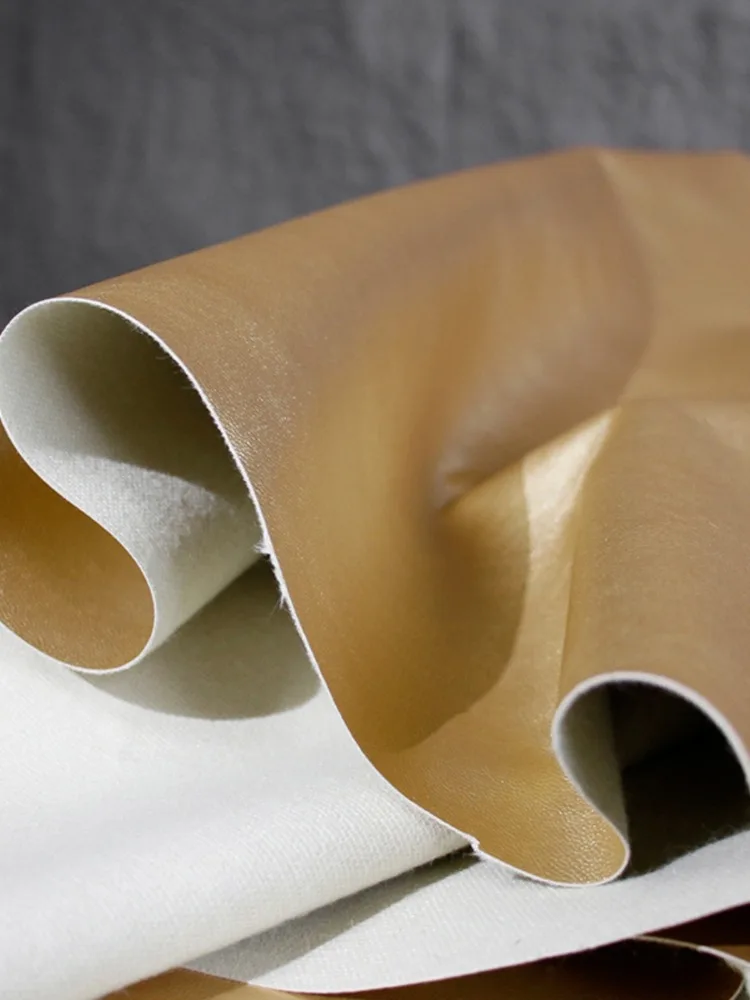 PU Leather Fabric Fine Grain Skin Champagne Gold Soft Leather Elastic Free Clothing Designer Fabric Cloth Apparel Sewing