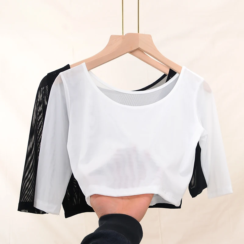 Damska koszulka na wiosnę i lato, dopasowany krój, okrągły dekolt, koronkowe wycięcia, długość do kolan, jednolity kolor.