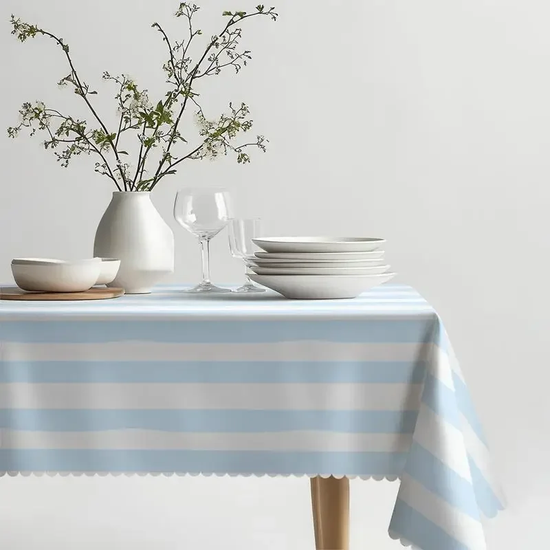 One rectangular polyester tablecloth with blue and white stripes, featuring ruffled edges.xzj