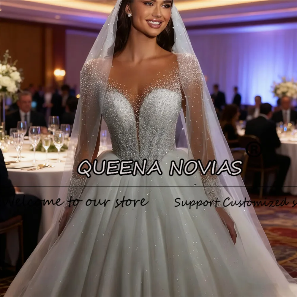 

Glittering O Neck Crystals Beaded Wedding Dresses Sweep Train Illusion Long Sleeves Bridal Gowns Customized Bride Banquet Dress