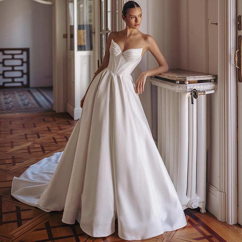 

Classic White Satin Evening Dress Dreamy Strapless Customized Wedding Dresses 2026 Lace Up Back Chapel Train Celebrity Gowns