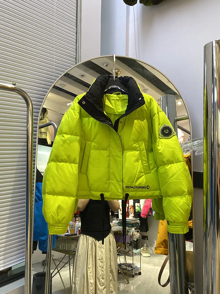 Chaqueta de plumón cálida con capucha para mujer, chaqueta de plumón de pato blanco a la moda con temperamento elegante, novedad de invierno de 2025