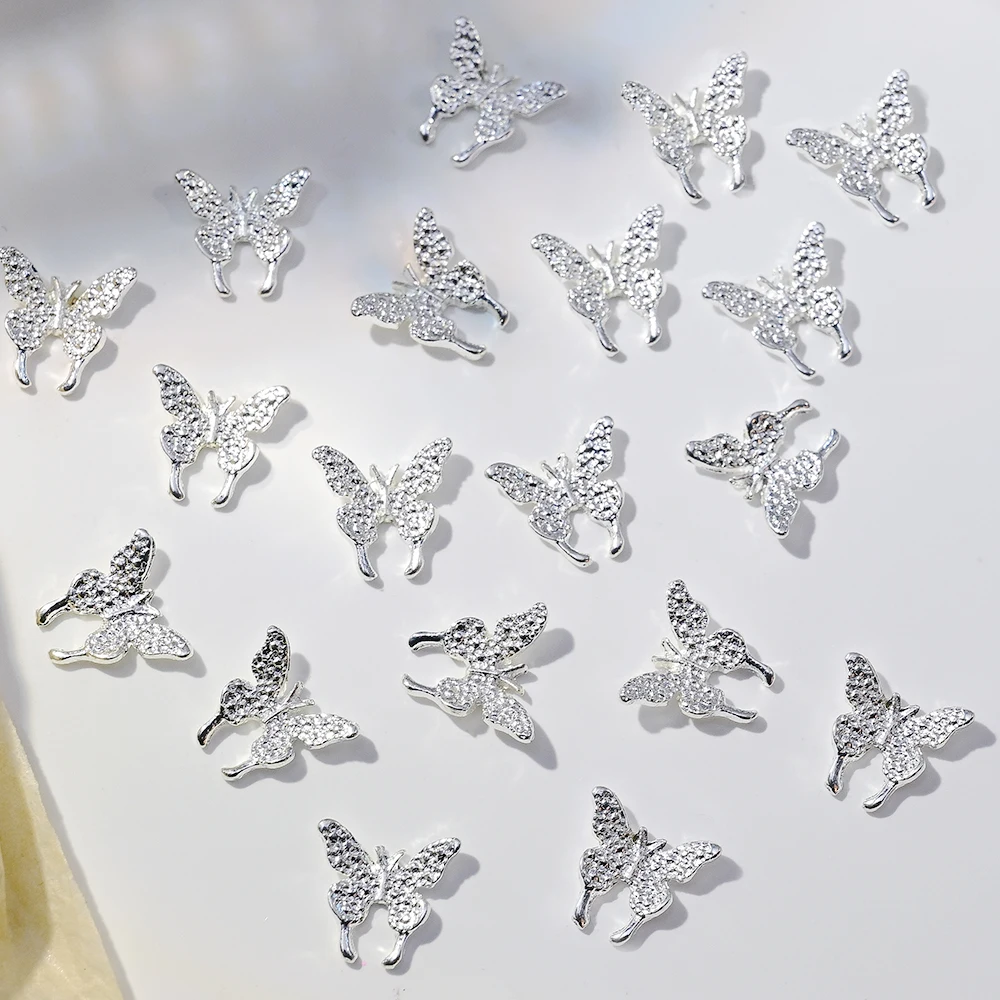 50Pcs 3D 실버 나비 네일 아트 매력 반짝이 다이아몬드 날개 나비 라인 석 DIY 럭셔리 매니큐어 장식 용품