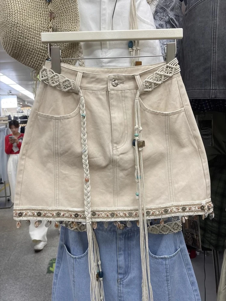 Summer 2025 New Fashion Women Denim Skirts Bohemian Style Weaving Edge Pendant Tassel A-line High Waist Short Skirt