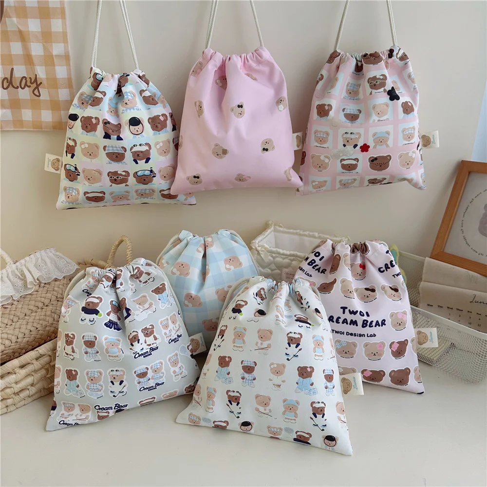 Cartoon bear drawstring pouch for baby clothes and diapers, dust-proof storage bag for diapers when out and about