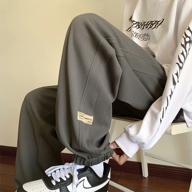 

Мужские повседневные спортивные брюки свободного кроя с широкими штанинами на шнурке для осени и зимы, модные, универсальные, с эластичным поясом, из полиэстера и спандекса