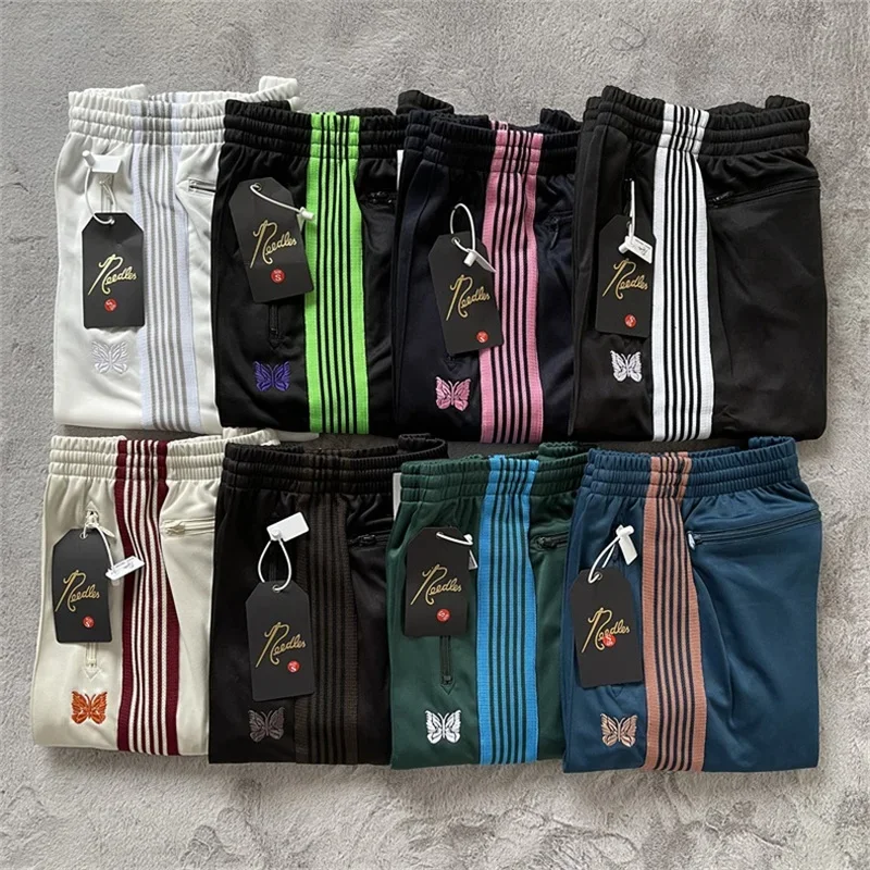 

25ss Butterfly Embroidery AWGE White Striped Sweatpants Men Women Best Quality Ribbon Pants Green Zipper Pocket Trousers