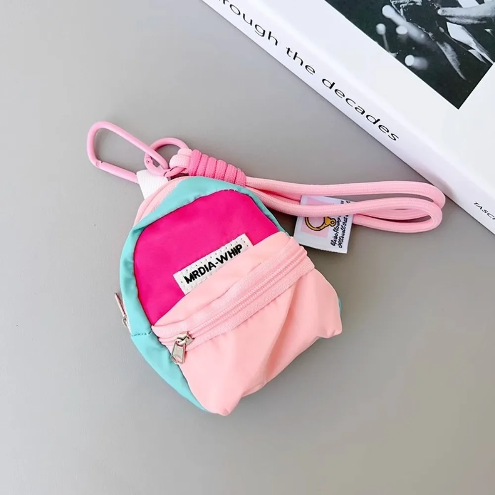 Creatieve hangende portemonnee contrasterende kleur korte polsband mini portemonnee anti-diefstal hanger oortelefoon opbergtas meisje