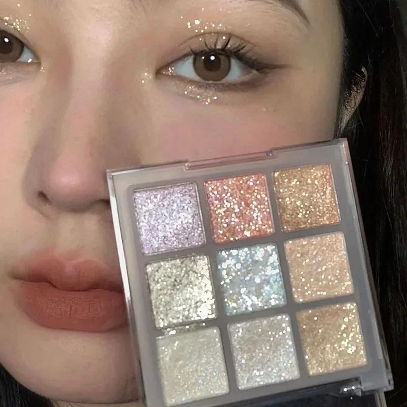 อายแชโดว์ 9 สีแวววาวพาเลทท์แชมเปญสีชมพูมุกอายแชโดว์ชิมเมอร์ไฮไลท์โทนเย็นแต่งหน้าประกายตาที่มีเสน่ห์