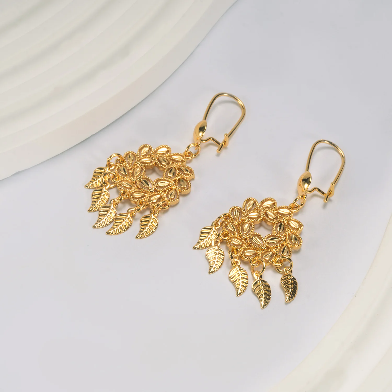 9999 gold Feng peacock earrings, European-style fringed bell earrings, Bohemian leaf pendant, scenic area, earrings
