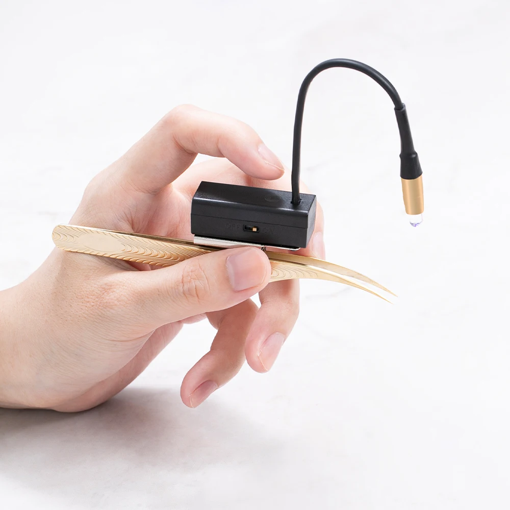 Pinky Leem's innovative touch-type light-emitting diode eyelash extension pliers with ultraviolet light