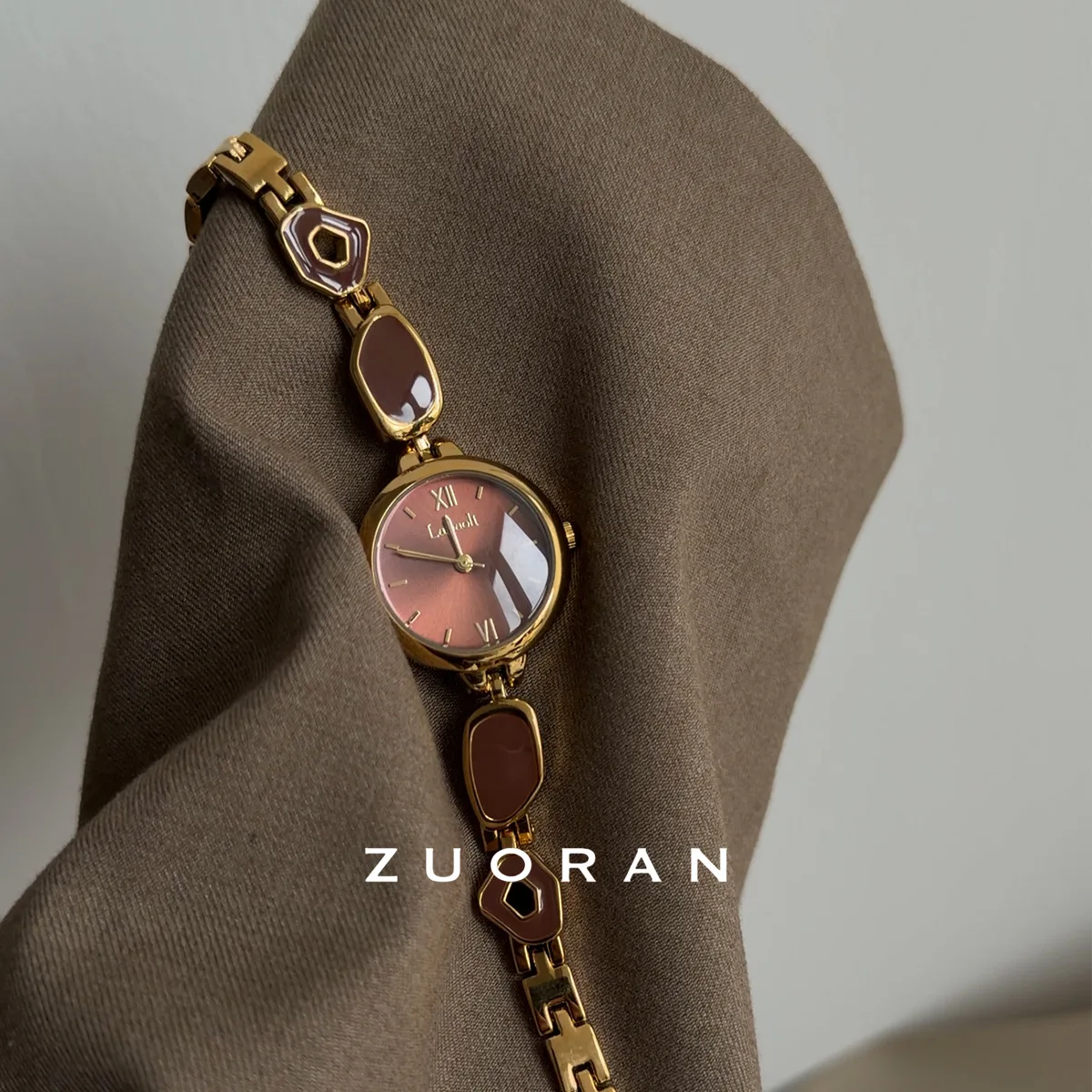 A sophisticated and stylish women's watch in a gold and brown color schemeperfect for autumn and winterA premium gift for women.