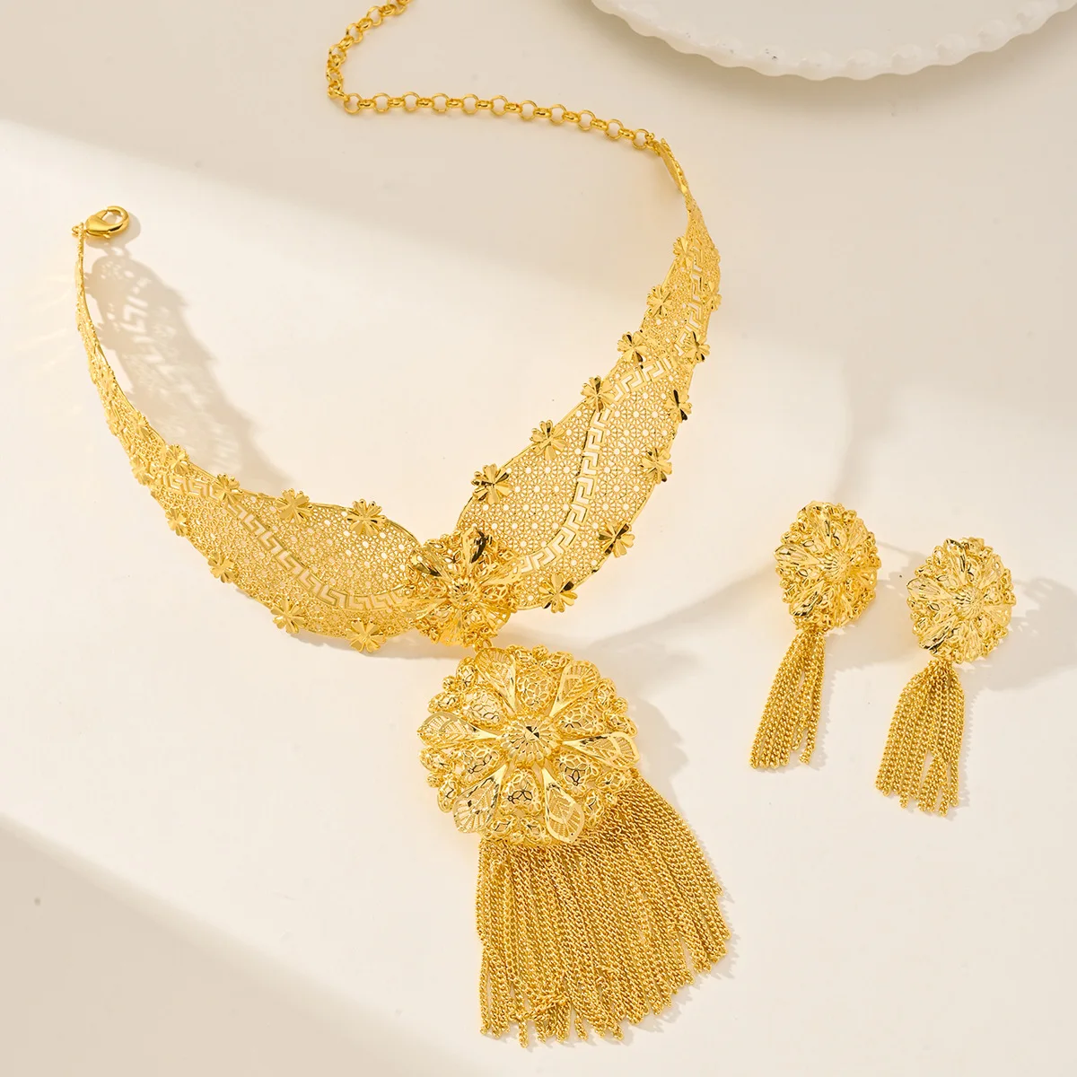 9999 gold jewelry set featuring African floral tassels. Saudi women's necklace and earrings set.