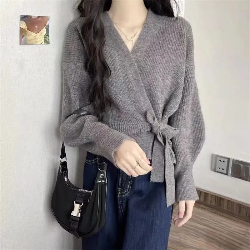 Cross shaped irregular strap waist slimming sweater cardigan women in autumn and winter chic lantern sleeve loose knit sweater