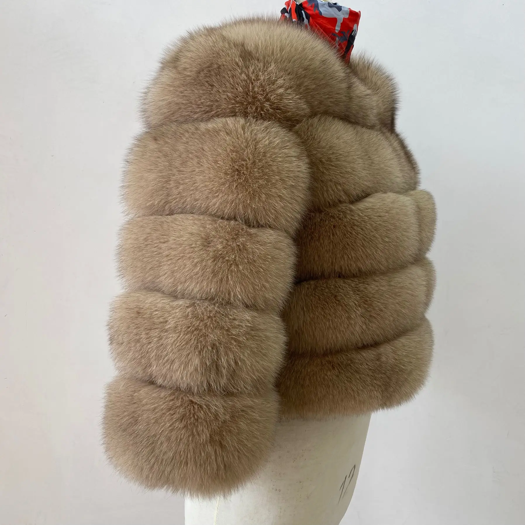 The lady's fashionable natural genuine fox fur women's winter fur coat. Fashionable fox fur natural fur women's coat. Genuine fo