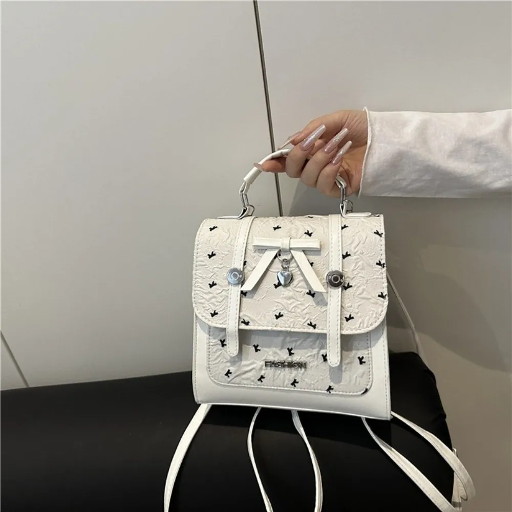 حقيبة ظهر نسائية على الطراز الياباني الجديد مصنوعة من جلد البولي يوريثان باللون الوردي والأبيض وحزام قابل للتحويل حقيبة كتف متينة مقاومة للماء للاستخدام غير الرسمي