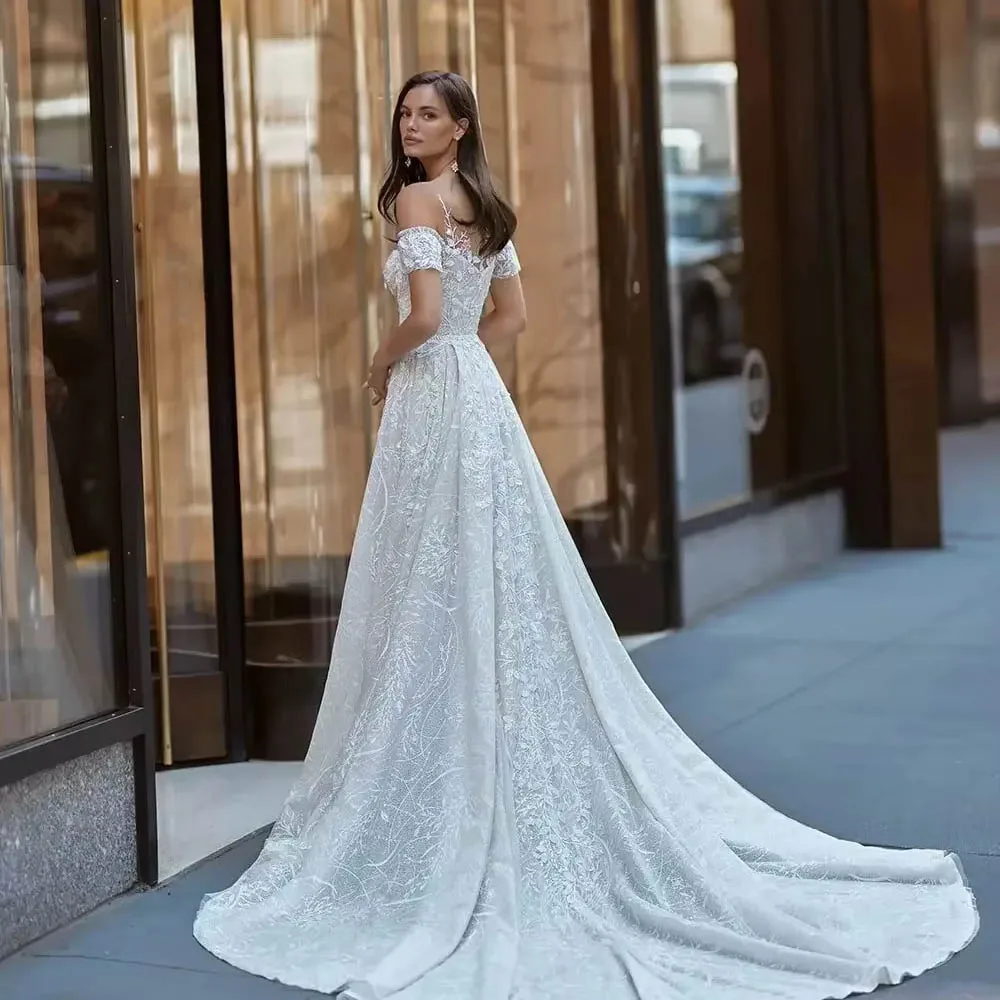 ชุดแต่งงานลูกไม้สุดหรูแบบสั่งตัดสำหรับเจ้าสาว ทรงเมอร์เมด ประดับด้วยเลื่อมระยิบระยับ พร้อมชายกระโปรงถอดได้ ไหล่ตกทรงเข้ารูป