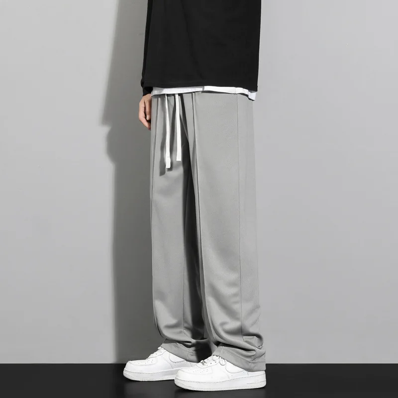 موضة صيف 2025 للرجال بنطال واسع الساق مستقيم بلون سادة غير رسمي عصري بسيط للرجال مقاس كبير بدلة أساسية وسراويل ملابس