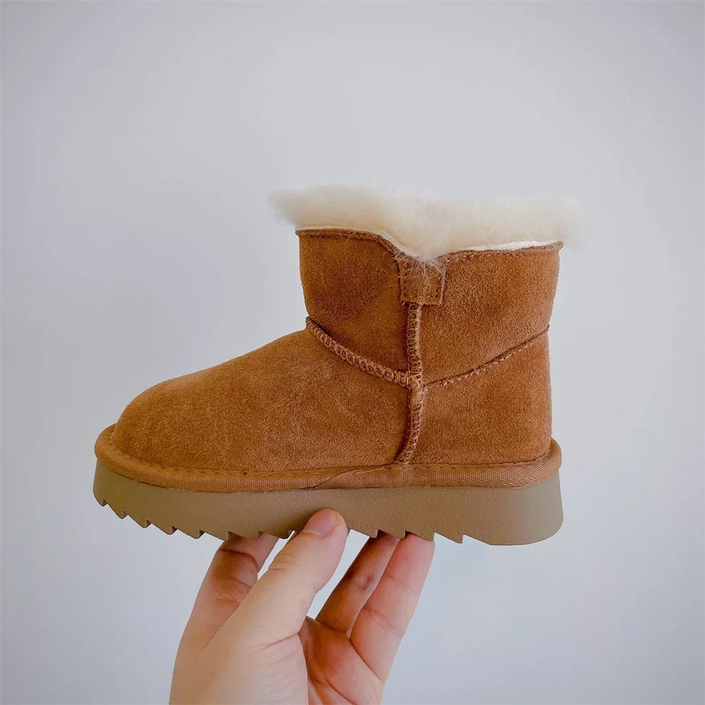 Nieuwe stijl winter nieuwe kinderschoenen jongen lederen dikke snowboots meisje modieuze warme katoenen laarzen