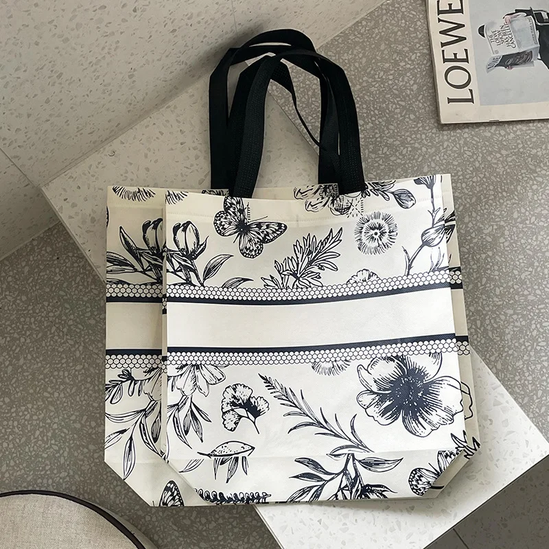 프리미엄 맞춤형 로고 부직포 토트백 - 가정, 비즈니스 및 의류 매장용 재사용 가능한 친환경 쇼핑 선물 가방(1/10개)