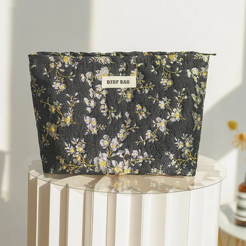 Borsa cosmetica femminile con fiore nero borsa da viaggio portatile per il cambio cosmetico di grande capacità borsa per la conservazione del