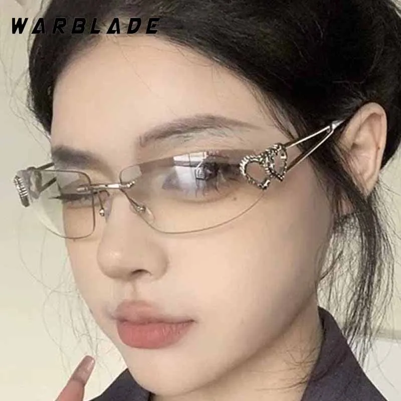 

2025 New Fashion Design Metal Heart Decoration Rimless Women Sunglasses Luxury Y2K Men Sunglass Street Snap Party Eyewear UV400