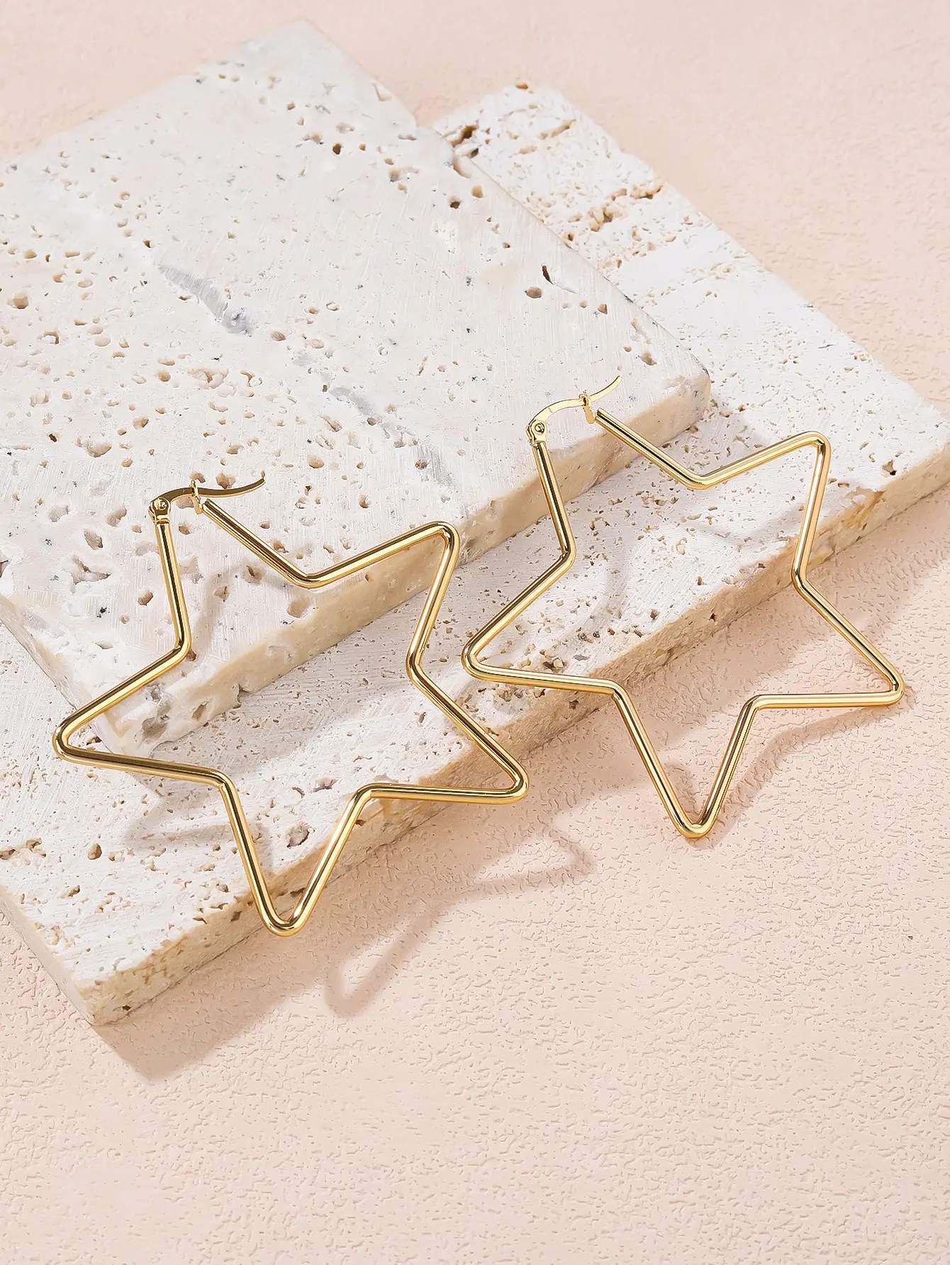 

Geometric Star Outline Hoop Earrings in Gold Tone Metal